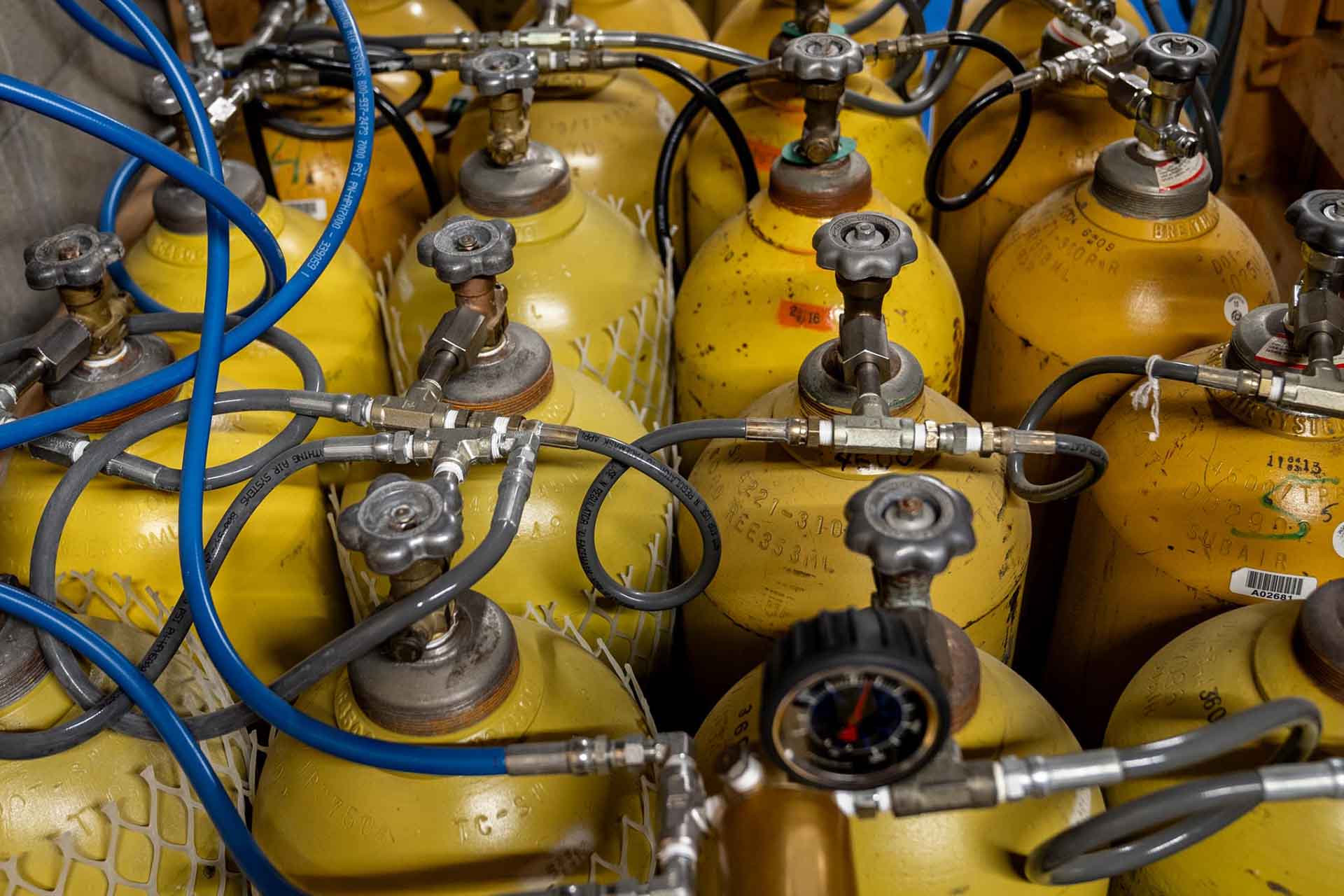 Cascade storage bank system with yellow high-pressure T-bottles for 13000 cubic feet air capacity Columbus Scuba