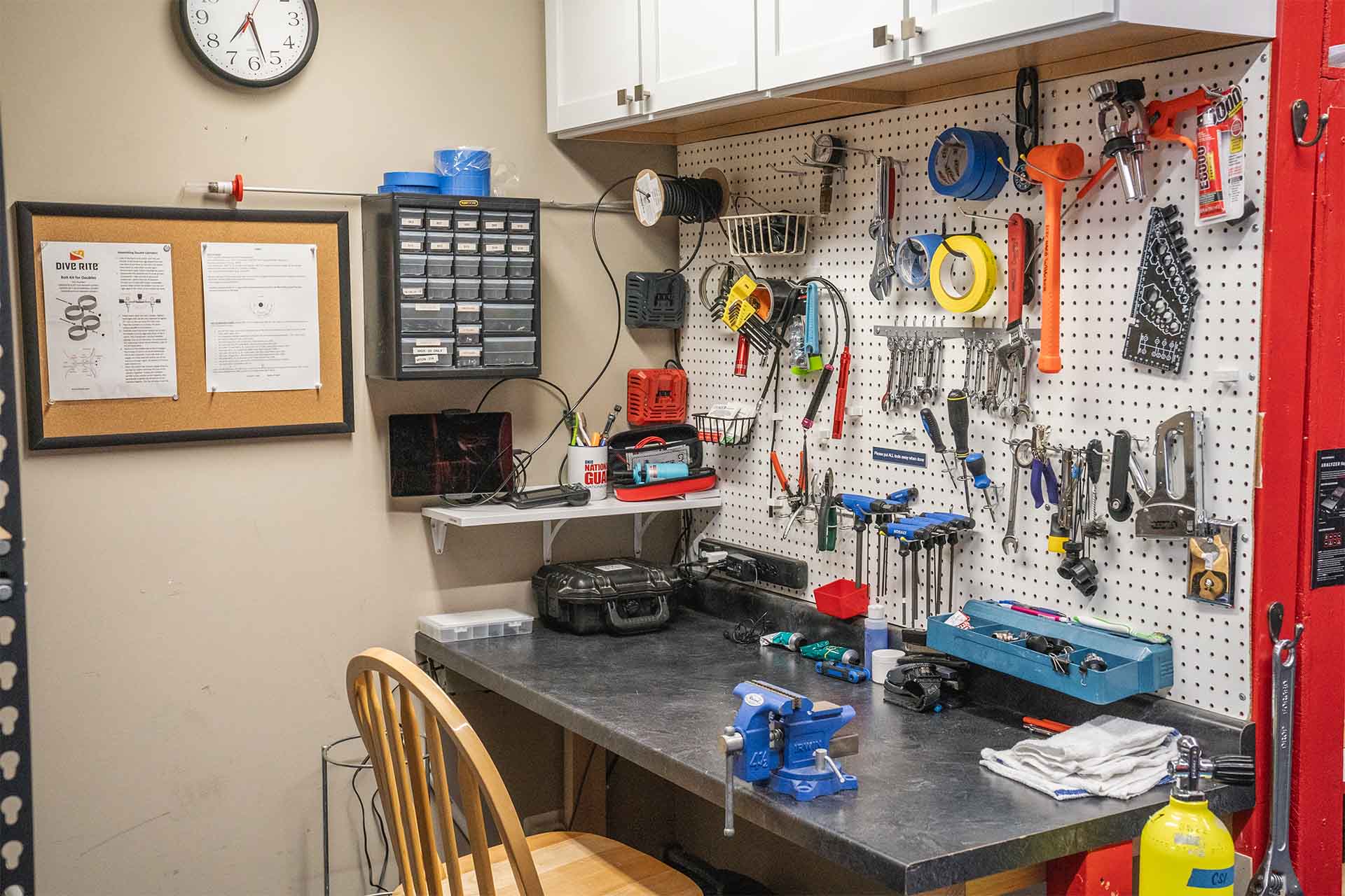 Service Bay 2 organized workbench with tools and equipment storage at Columbus Scuba service bay